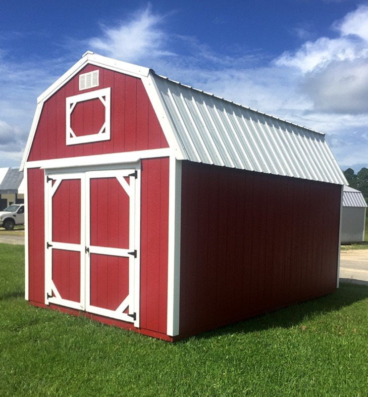 Red barn with interior lofts by Coastal Portable Buildings.